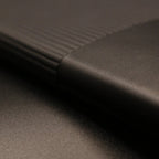 Close up image of textured soft touch black leather A5 journal