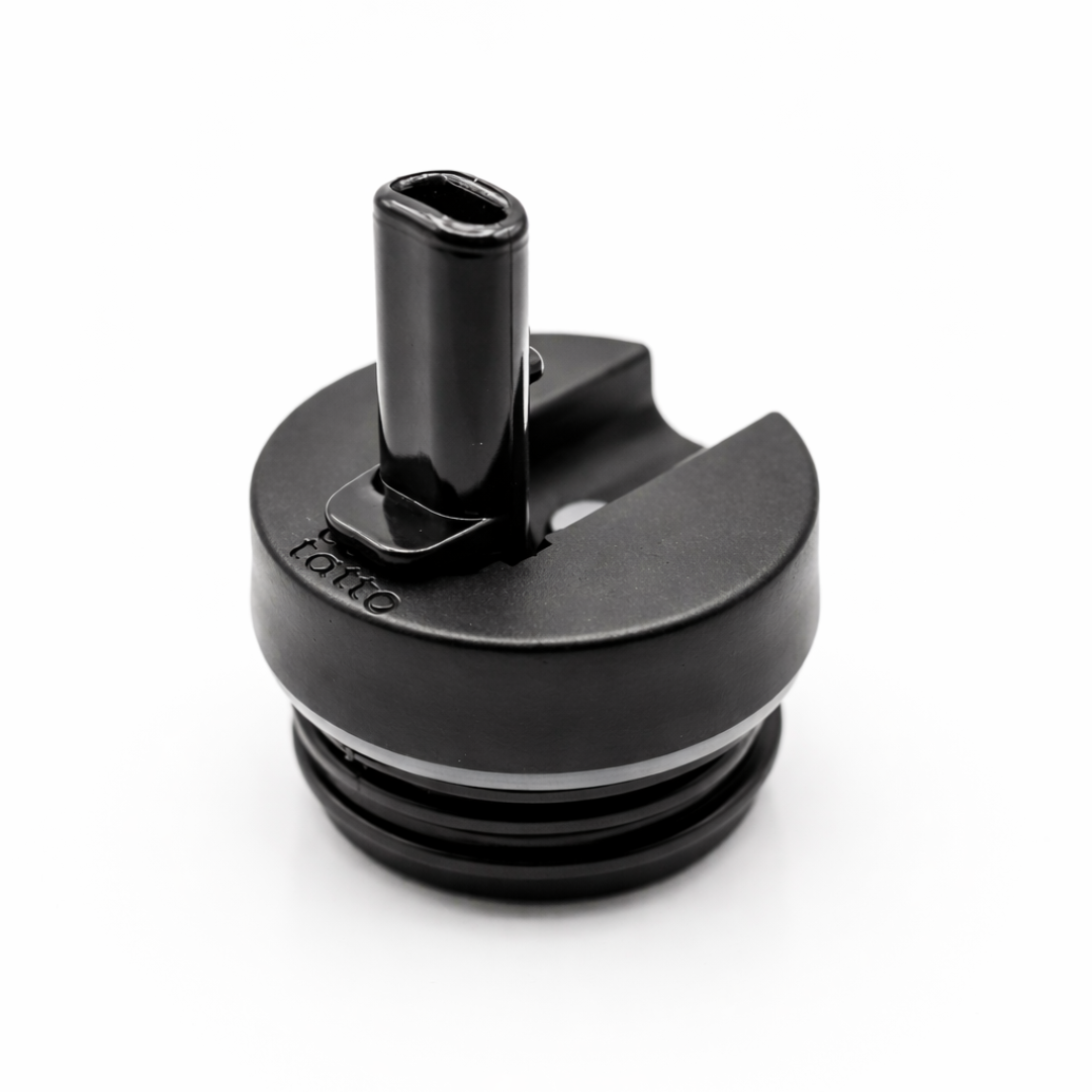 Black drink lid with straw holder on a white background