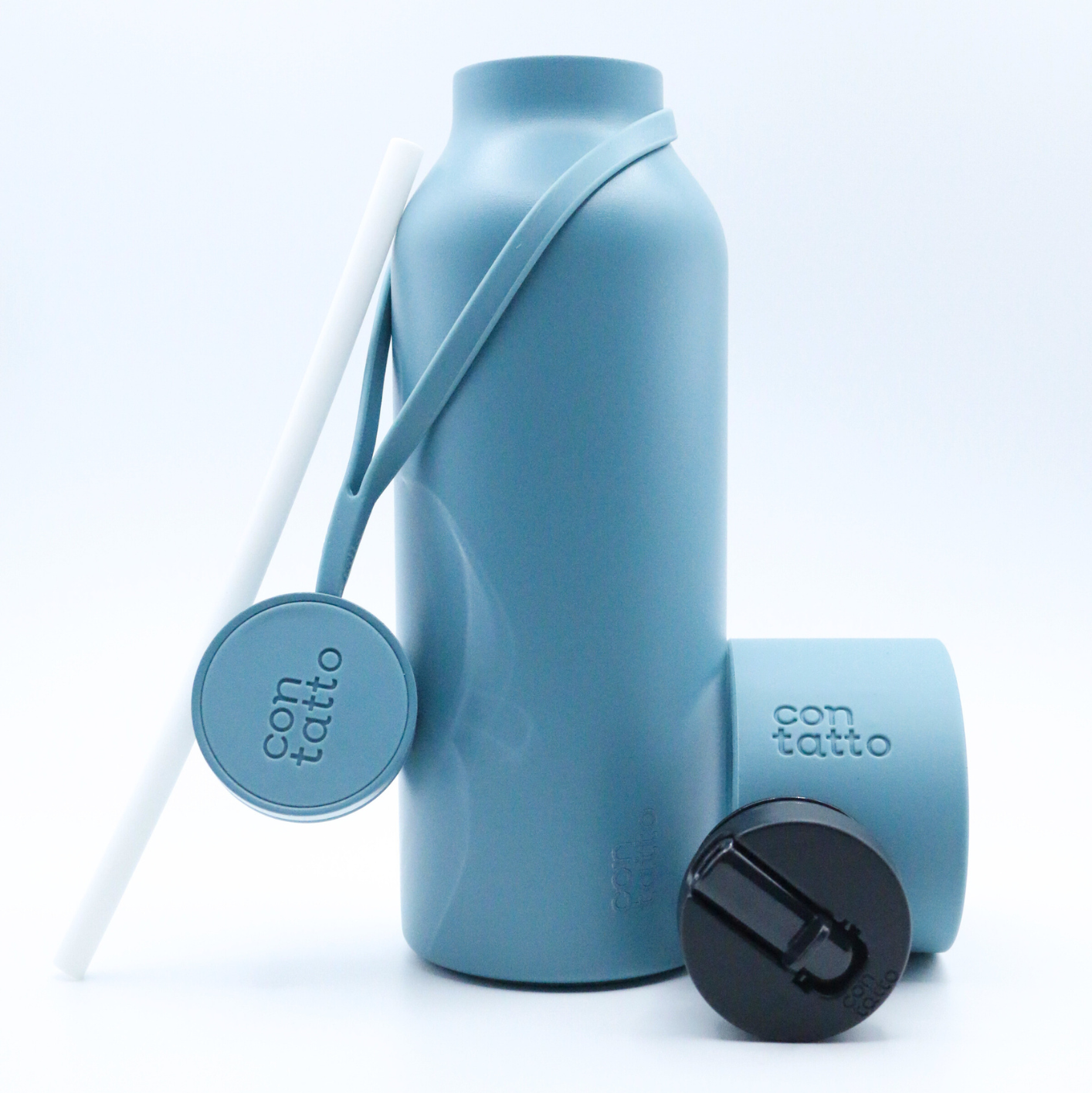 Blue water bottle with a strap and black cap on a white background