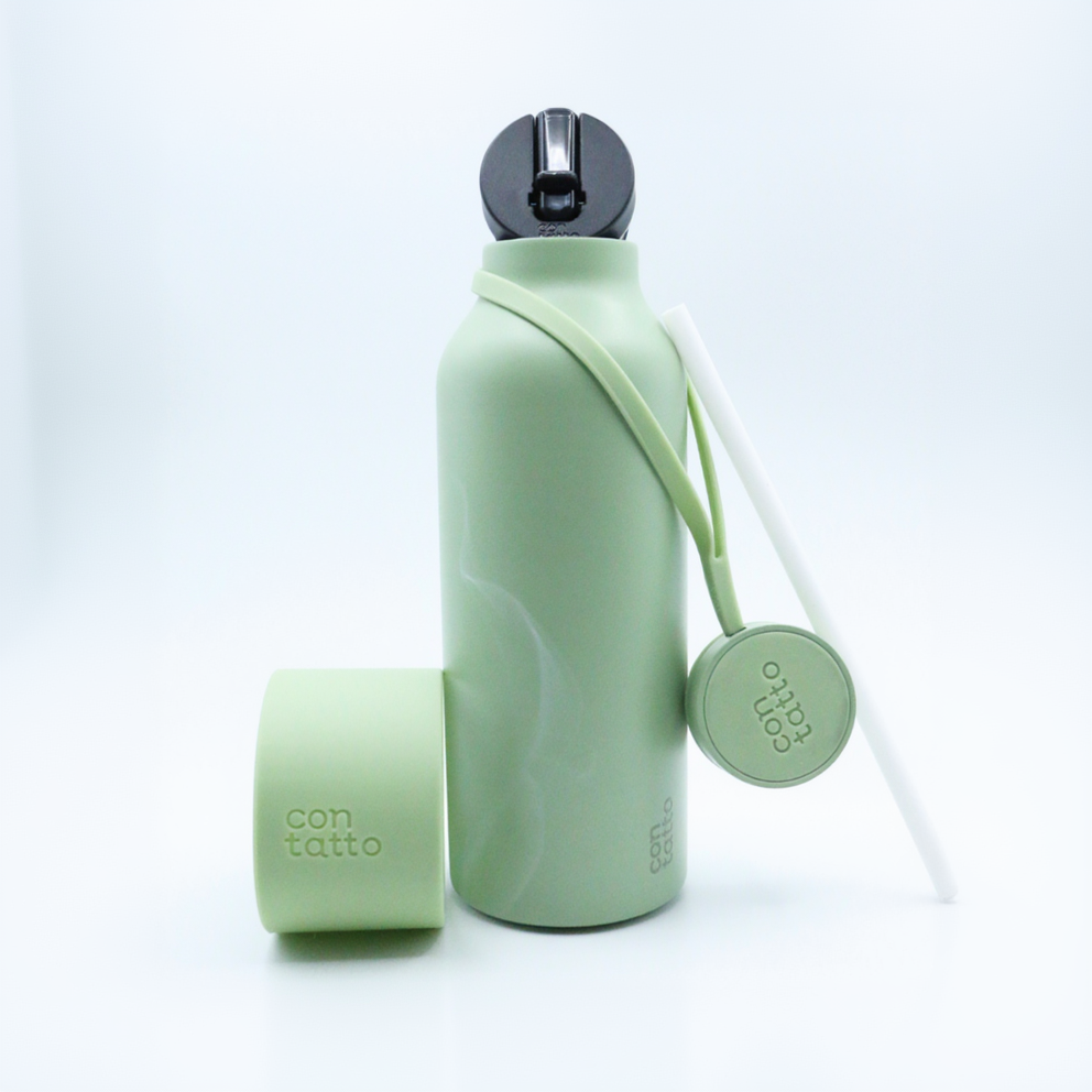 Green water bottle with a strap on a white background