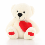 White teddy bear with a red heart on a white background