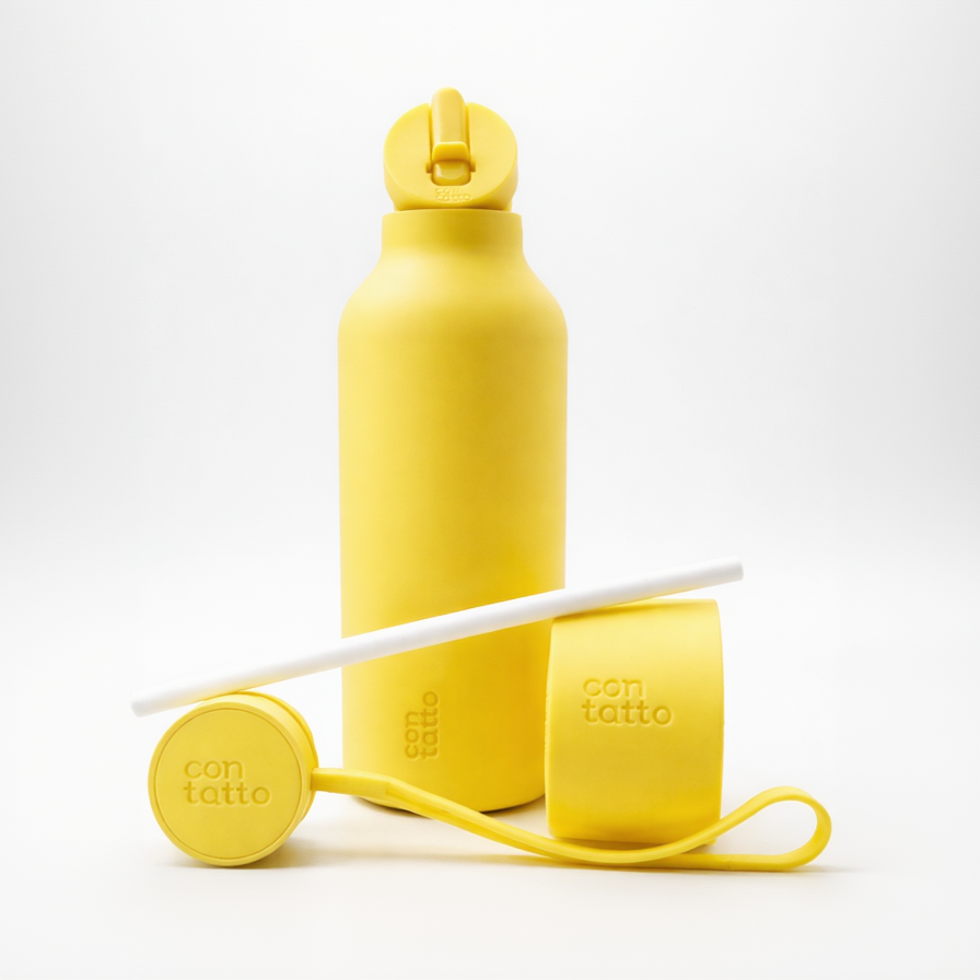 Yellow water bottle with straw and carrying strap on a white background