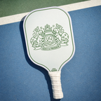 Pickleball paddle with a design on a blue surface