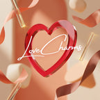 Red heart-shaped object with 'Love Charms' text on a beige background