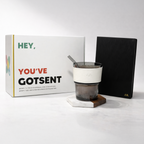 Gotsent product with packaging and a black notebook on a white background