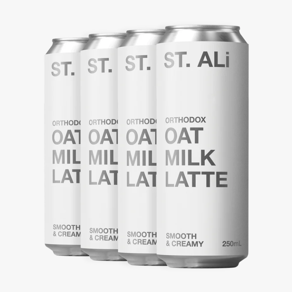 Four cans of St. Ali Oat Milk Latte on a white background