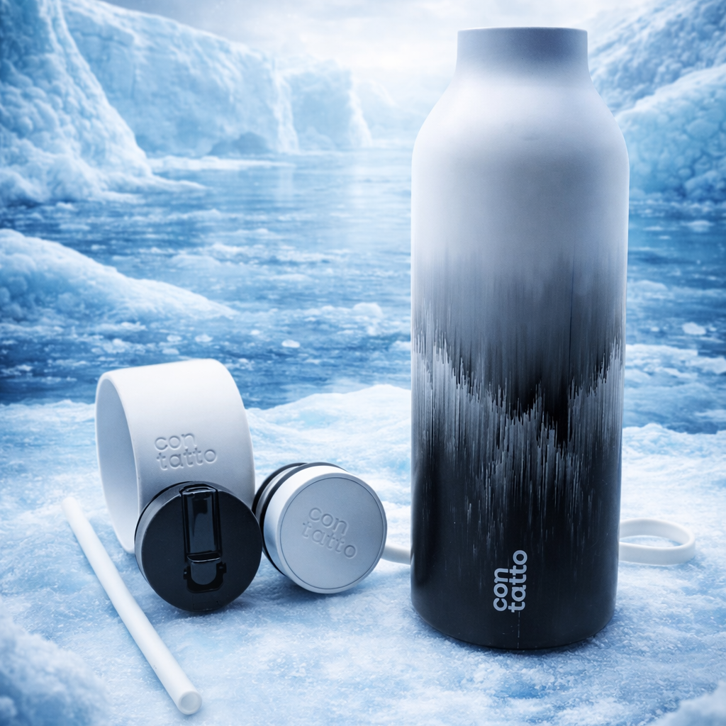 Black and white water bottle with accessories on a snowy background