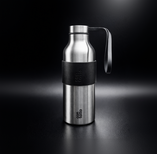 Stainless steel water bottle with silicone black sleeve on a dark background.